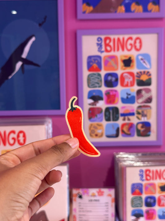 Patch thermocollant Piment inspiré de La Réunion. Écusson brodé à repasser, parfait pour customiser veste ou sac avec une touche locale piquante.